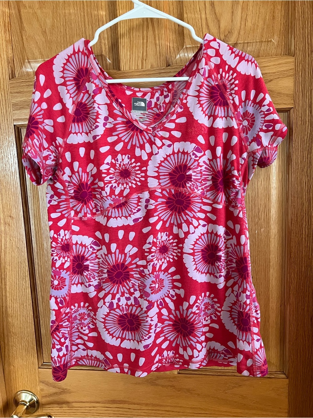 The North Face XL v neck short sleeve floral athletic tee.